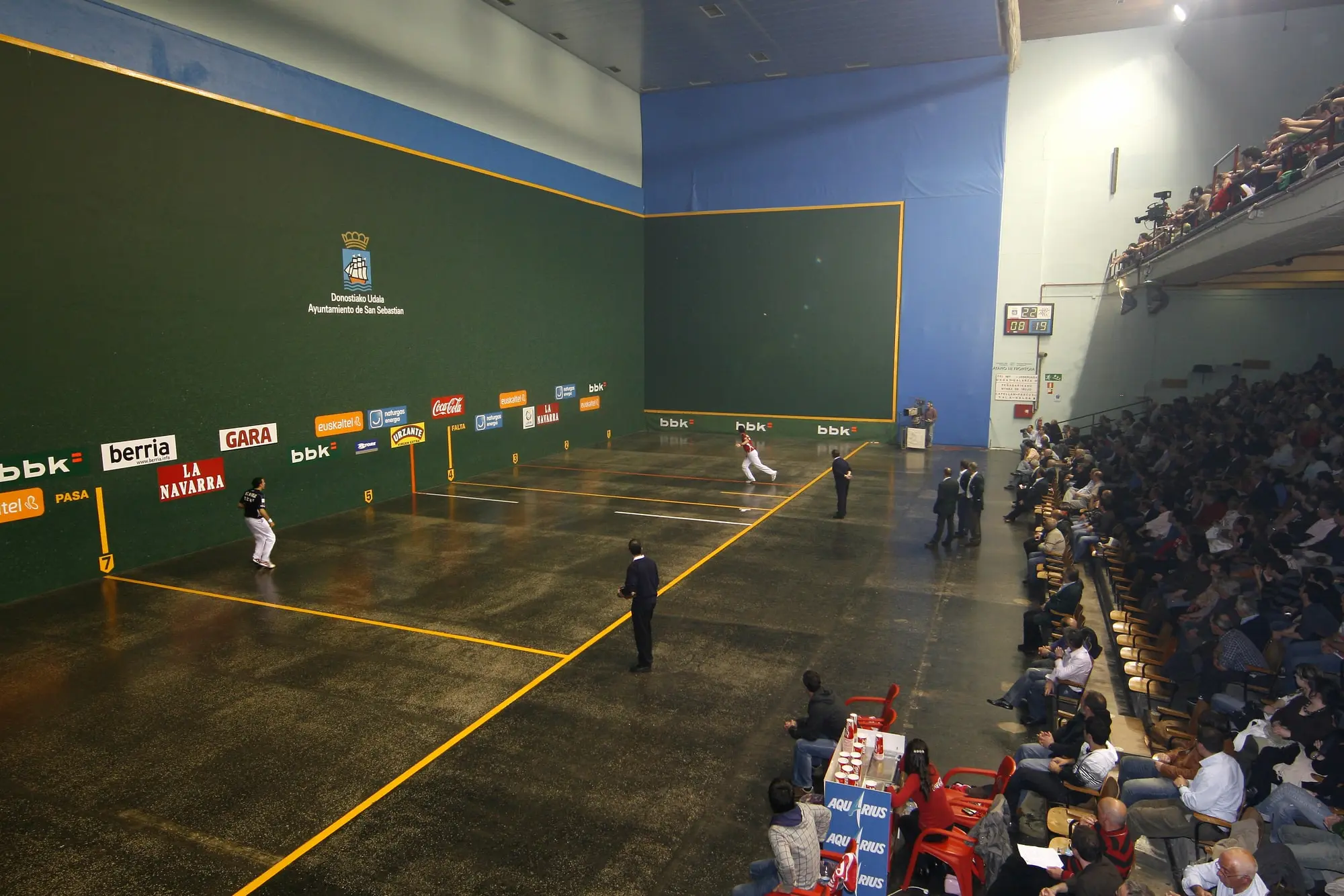 Fronton with people watching a Basque handball match.