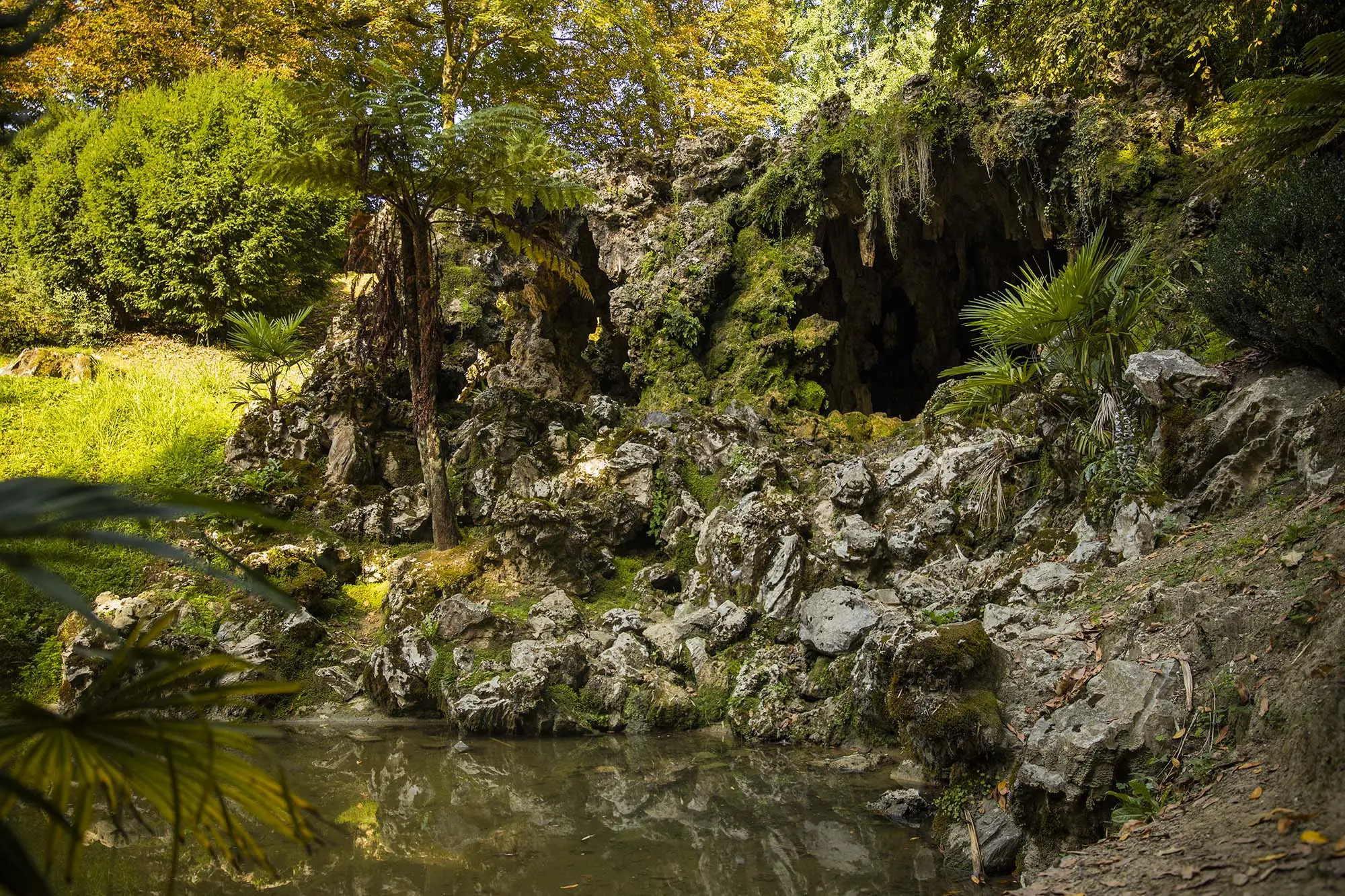 Entrance to a cave between rock formations in Aiete Park.